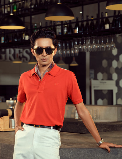Premium cotton pique detail on the Vermilion coral red minimalist polo shirt from Drip Club
