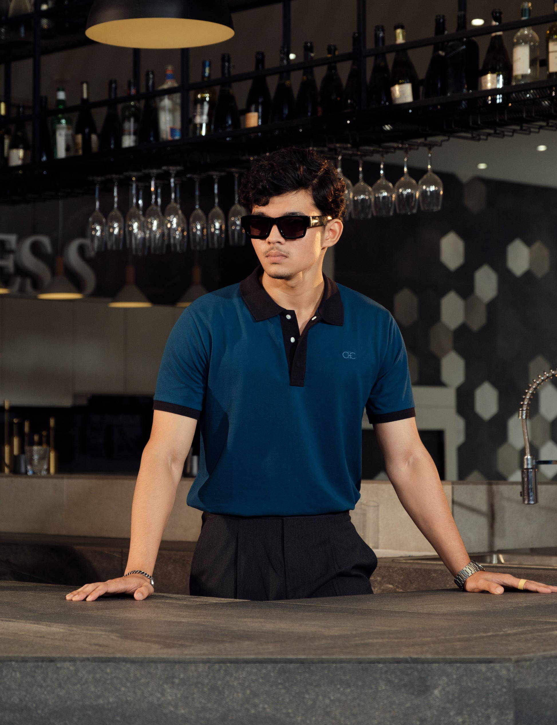 Drip Club Apatite teal minimalist polo shirt worn by a model, relaxed unisex fit