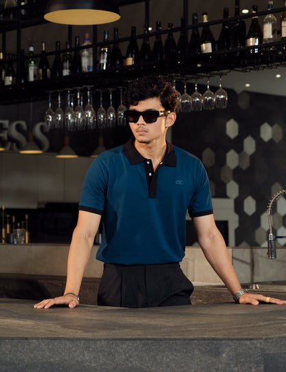 Drip Club Apatite teal minimalist polo shirt worn by a model, relaxed unisex fit